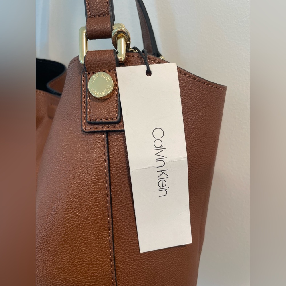 Calvin Klein reversible brown + black purse with additional clutch. New w tags